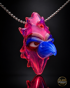 Hand-blown heady glass totem bird pendant by creepglass. Featuring red gold ruby glass. Hanging from a ball chain necklace.