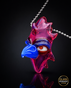 Hand-blown heady glass totem bird pendant by creepglass. Featuring red gold ruby glass. Hanging from a ball chain necklace.