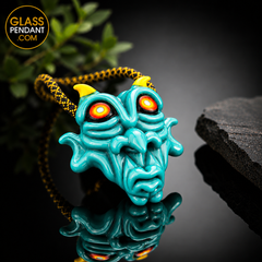 Hand-blown heady glass goblin pendant by @kalebfolckglass. Featuring hand sculpting. Hanging from a paracord necklace.