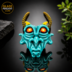 Hand-blown heady glass goblin pendant by @kalebfolckglass. Featuring hand sculpting. Hanging from a paracord necklace.