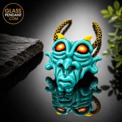 Hand-blown heady glass goblin pendant by @kalebfolckglass. Featuring hand sculpting. Hanging from a paracord necklace.