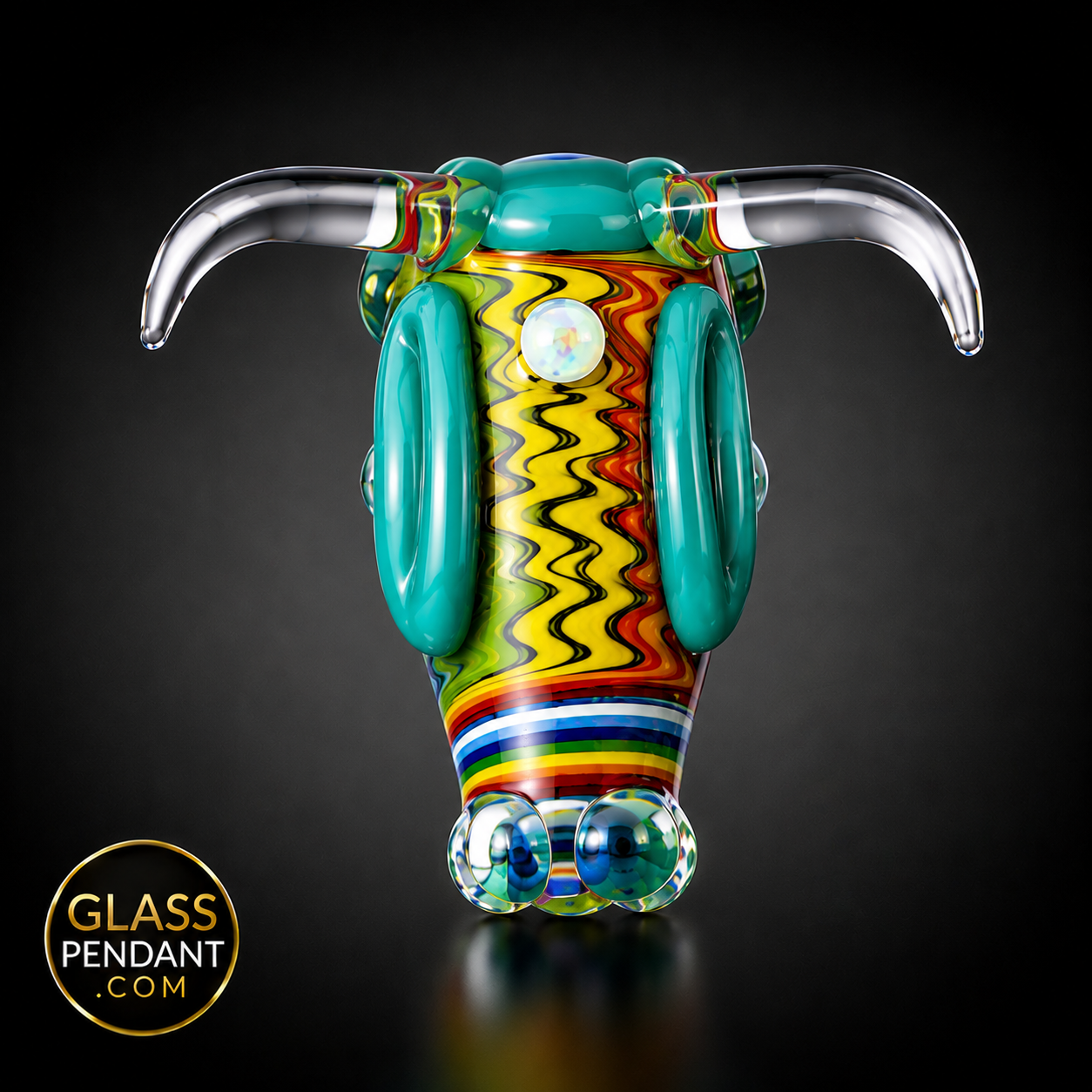 Hand-blown heady glass bull pendant by @kmanglass. Featuring third eye opal, rainbow wig wag linework. Hanging from a paracord necklace.
