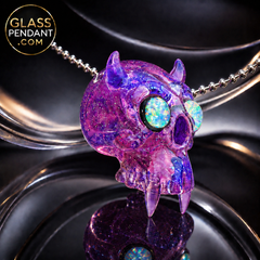 Hand-blown heady glass kali skull pendant by @leebrodee. All crushed opal. Featuring molten aura glass, and 2 encased opal eyes, and fangs. Hanging from a paracord necklace.