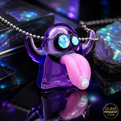 Hand-blown heady glass emoji ghost pendant by leebrodee. Featuring CFL color-changing parallax glass, encased opal eyes, and a dosed opal tongue. Hanging from a ball chain necklace. 